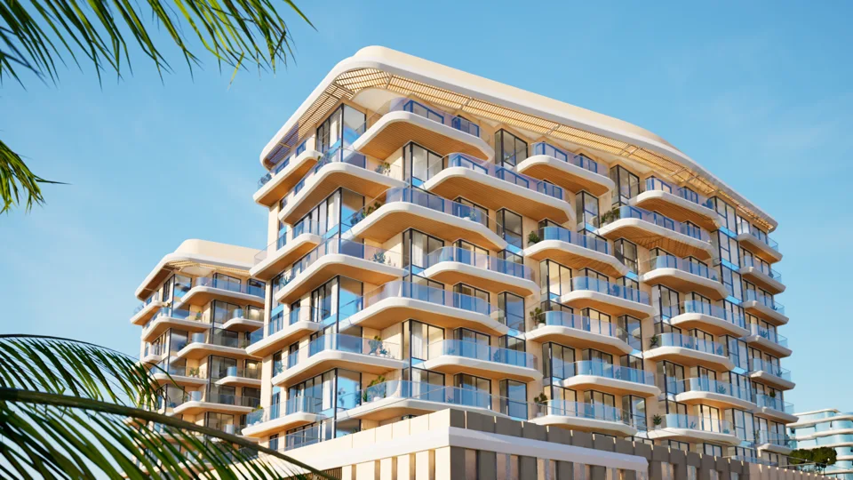 The curved balconies of Blue Marina Residence against a clear sky