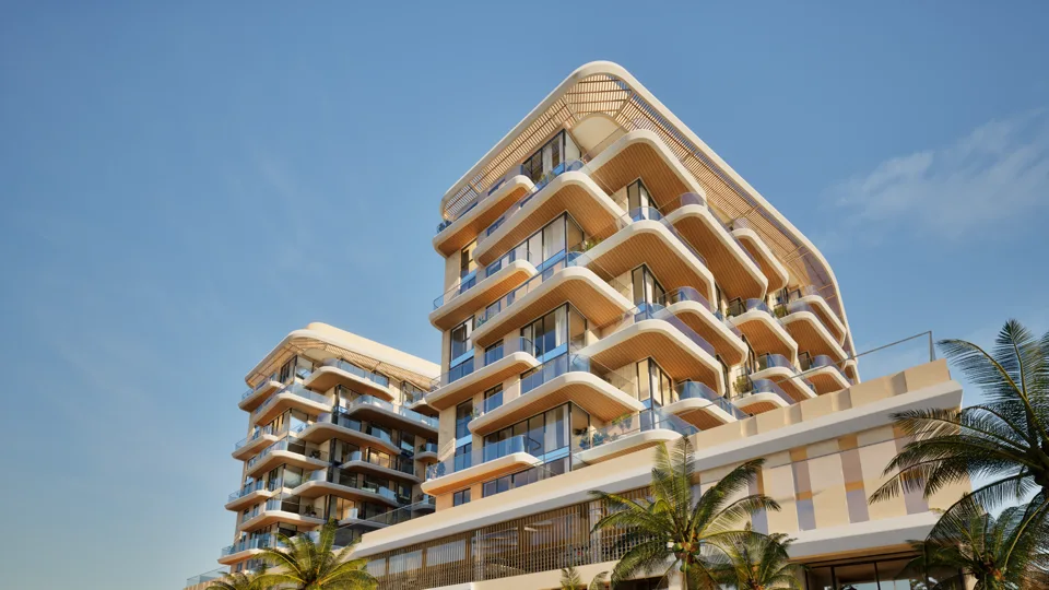Exterior view of Blue Marina Residence showing the sculpted facade and rounded balconies